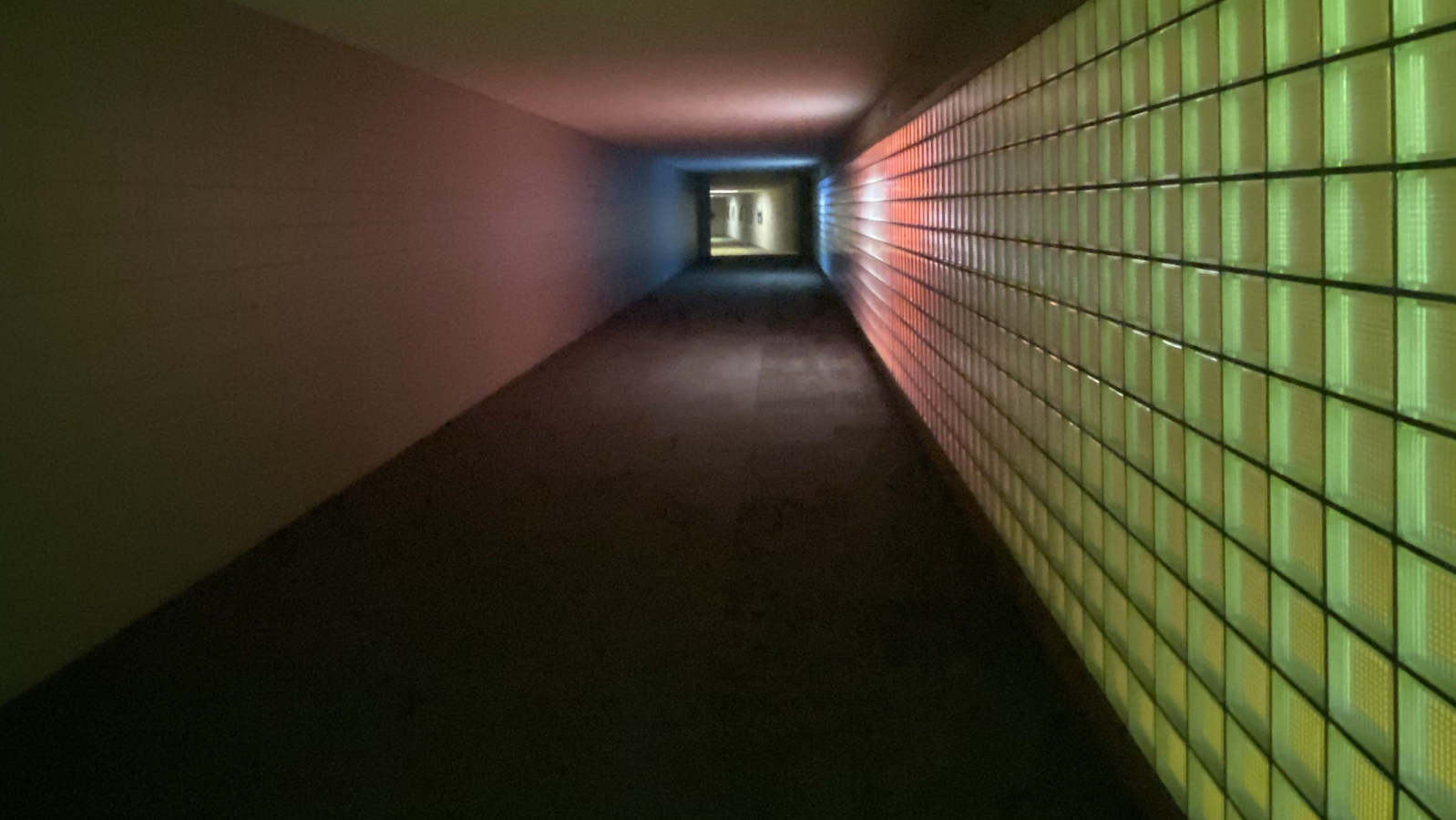 The meme is a simple, dark image of a long, empty hallway. The text "I can smell the desperation" appears at the top of the image, implying that the person who shared the image is feeling overwhelmed or frustrated with their situation. The image is likely meant to be humorous or relatable, poking fun at the idea that the person is feeling trapped or stuck in a situation.